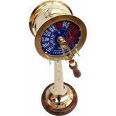 A standing brass engine order telegraph with a wooden base
